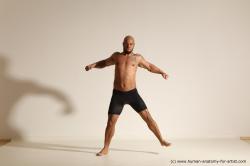 Underwear Gymnastic poses Man Black Muscular Bald Dancing Dynamic poses Academic